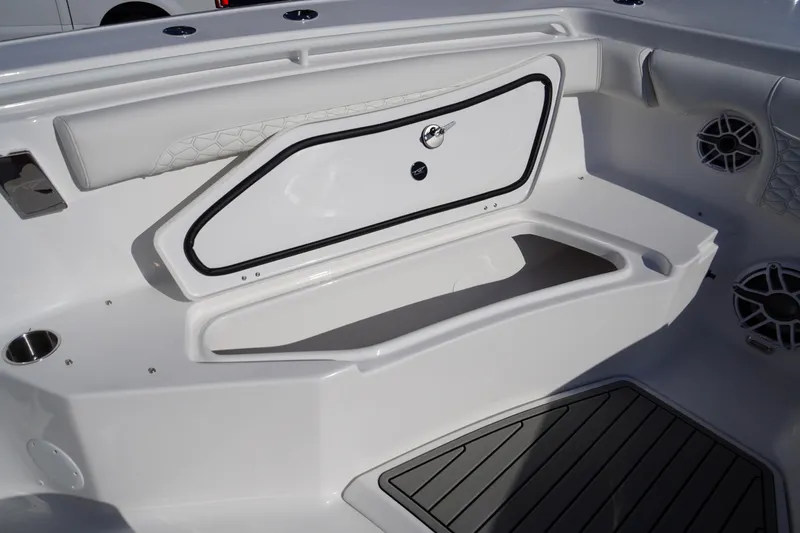 Slide: The Image of 2026 Tidewater 272 LXF boat interior with storage compartment and seating area. - 17