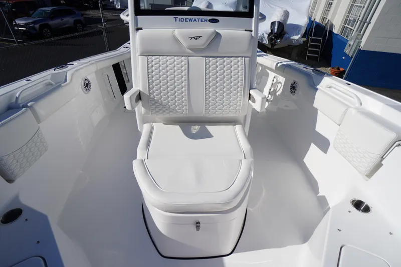 Slide: The Image of 2026 Tidewater 272 LXF boat interior with white cushioned seating and modern design. - 19
