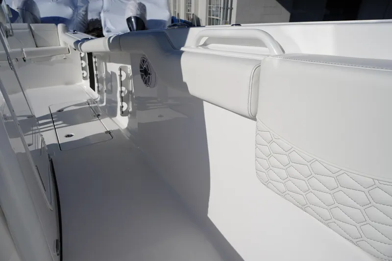 Slide: The Image of 2026 Tidewater 272 LXF boat interior with white seating and sleek design. - 23