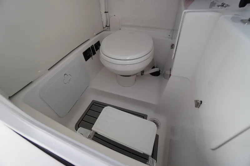 Slide: The Image of 2026 Tidewater 272 LXF boat interior bathroom with toilet and compact design. - 29