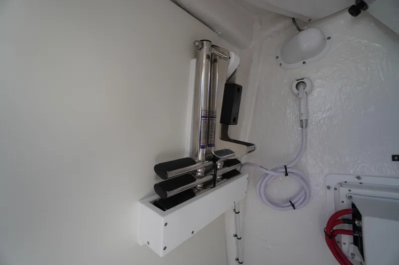 Slide: The Image of 2026 Tidewater 272 LXF interior detail with mounted equipment and coiled hose. - 31