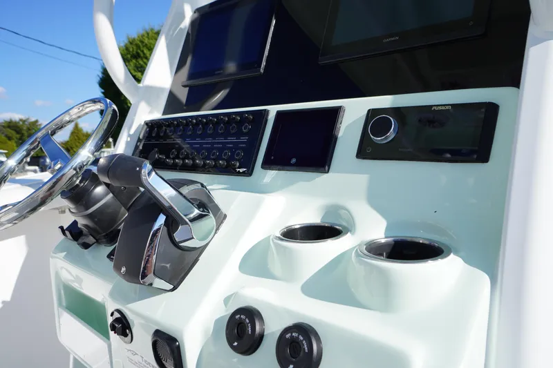 Slide: The Image of 2026 Tidewater 272 LXF boat dashboard with steering wheel and control panel. - 35