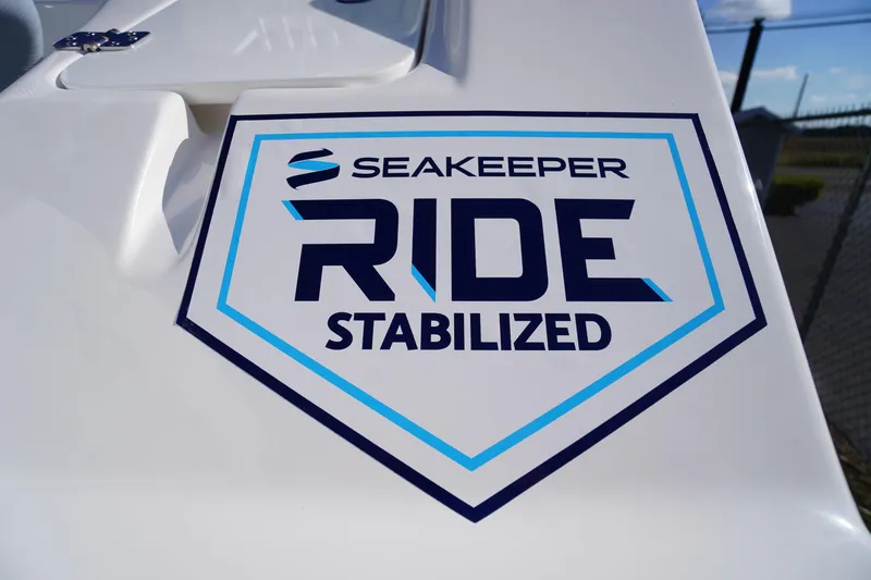 Slide: The Image of 2026 Tidewater 272 LXF boat featuring Seakeeper Ride Stabilized technology logo. - 4