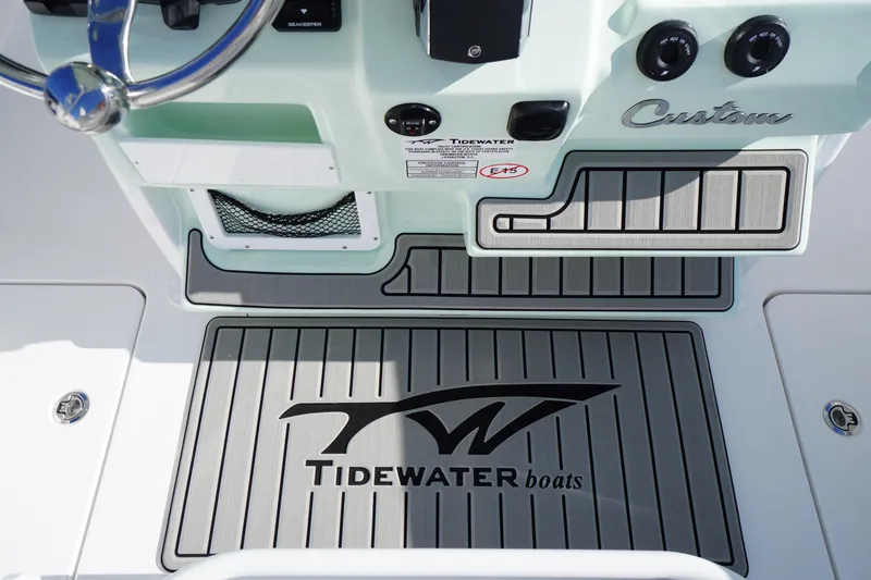 Slide: The Image of Tidewater 272 LXF 2026 boat dashboard with custom design and logo mat. - 40