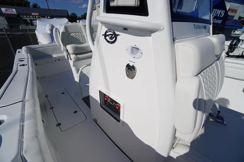 Slide: The Image of 2026 Tidewater 272 LXF boat interior with white seating and control panel. - 41