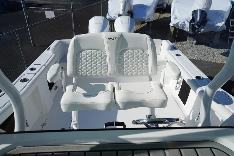 Slide: The Image of 2026 Tidewater 272 LXF boat interior with luxurious white seating and modern design. - 45