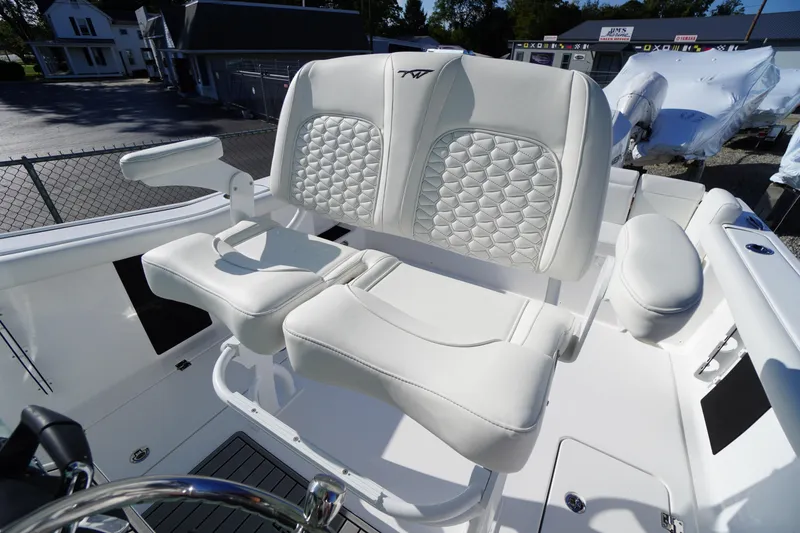 Slide: The Image of 2026 Tidewater 272 LXF boat with luxurious white seating and modern design. - 48
