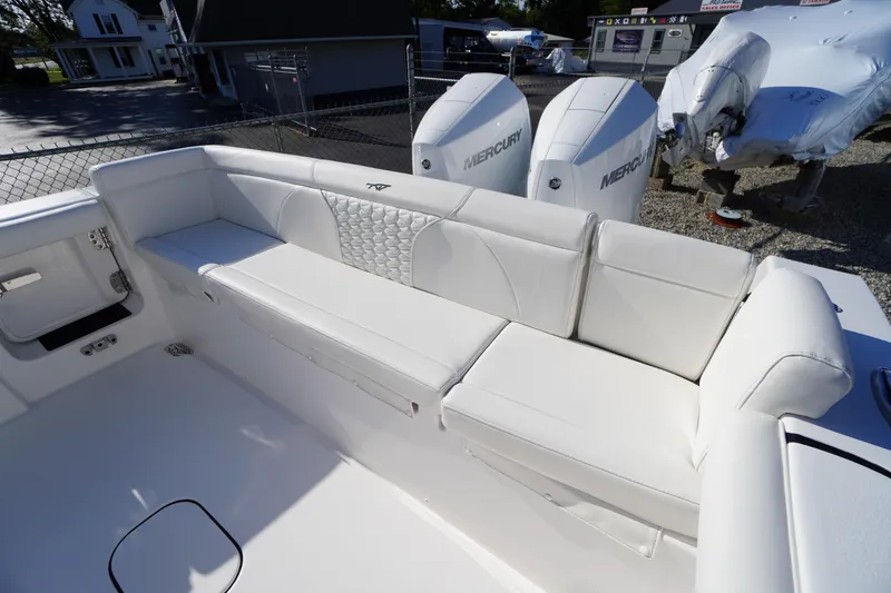 Slide: The Image of 2026 Tidewater 272 LXF boat with white seating and dual Mercury engines. - 50
