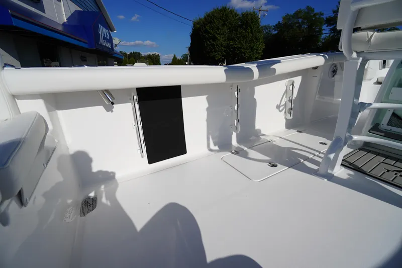Slide: The Image of 2026 Tidewater 272 LXF boat interior with sleek white deck and seating. - 60