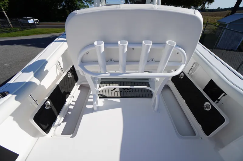 Slide: The Image of 2026 Tidewater 272 LXF boat interior with rod holders and storage compartments. - 62