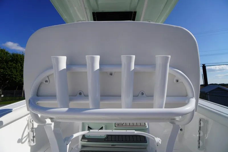 Slide: The Image of 2026 Tidewater 272 LXF boat rod holders under clear blue sky. - 63
