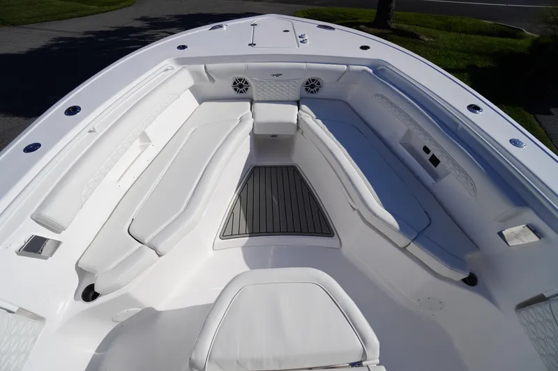 Slide: The Image of 2026 Tidewater 272 LXF boat interior with white seating and deck. - 7