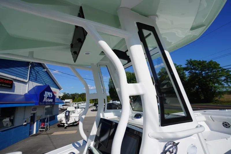Slide: The Image of 2026 Tidewater 272 LXF boat at Jim's Marine dealership, showcasing sleek design and modern features. - 70