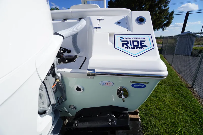 Slide: The Image of 2026 Tidewater 272 LXF boat with Seakeeper Ride stabilization system, docked outdoors. - 76