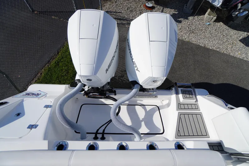 Slide: The Image of 2026 Tidewater 272 LXF boat with dual Mercury outboard engines, top view. - 81
