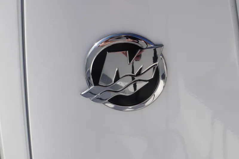 Slide: The Image of Chrome emblem on 2026 Tidewater 272 LXF boat, featuring sleek design elements. - 83