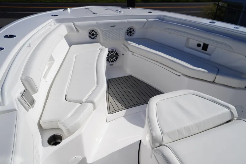 Slide: The Image of 2026 Tidewater 272 LXF boat interior with white seating and sleek design. - 9