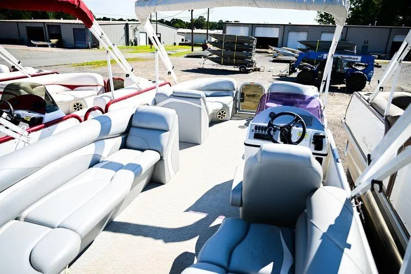 Slide: The Image of 2023 Aloha Pontoon Mahalo 23 interior with spacious seating and modern controls. - 9