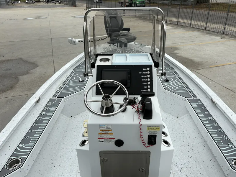 Slide: The Image of 2020 Xpress H20 B boat console with steering wheel and control panel. - 6