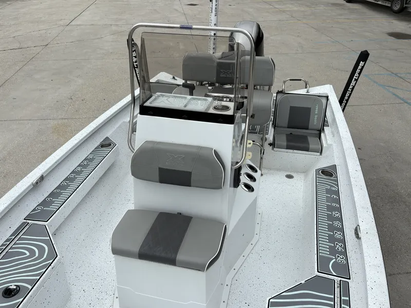 Slide: The Image of 2020 Xpress H20 B boat interior with seating and measurement graphics. - 7