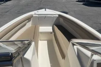 Slide: The Image of 2022 Scout 210 Dorado boat interior with beige seating and sleek design. - 9