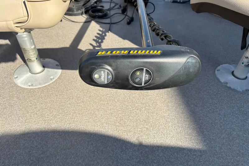 Slide: The Image of Minn Kota trolling motor on 2017 Sun Tracker Fishin' Barge 22 XP3 boat deck. - 12