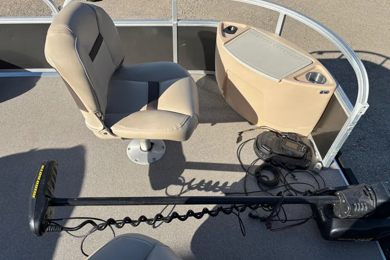 Slide: The Image of 2017 Sun Tracker Fishin' Barge 22 XP3 interior with fishing seat and equipment. - 13