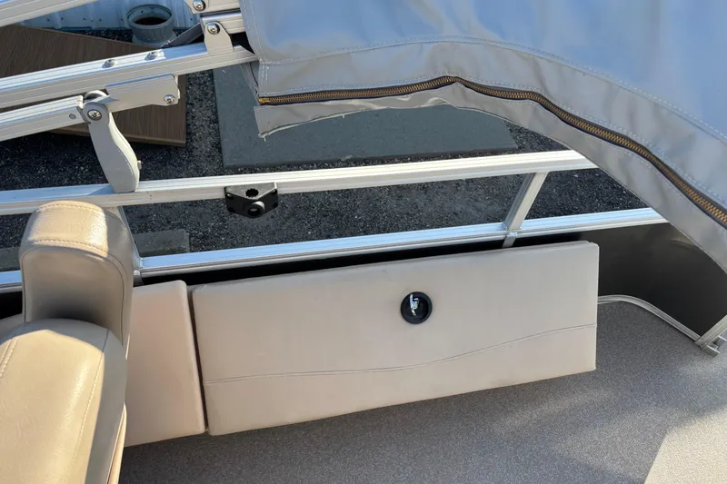 Slide: The Image of 2017 Sun Tracker Fishin' Barge 22 XP3 interior with beige seating and railing. - 17