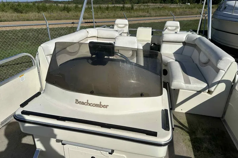 Slide: The Image of 2003 Beachcomber 24 Fish & Play pontoon boat with spacious seating and windshield. - 3
