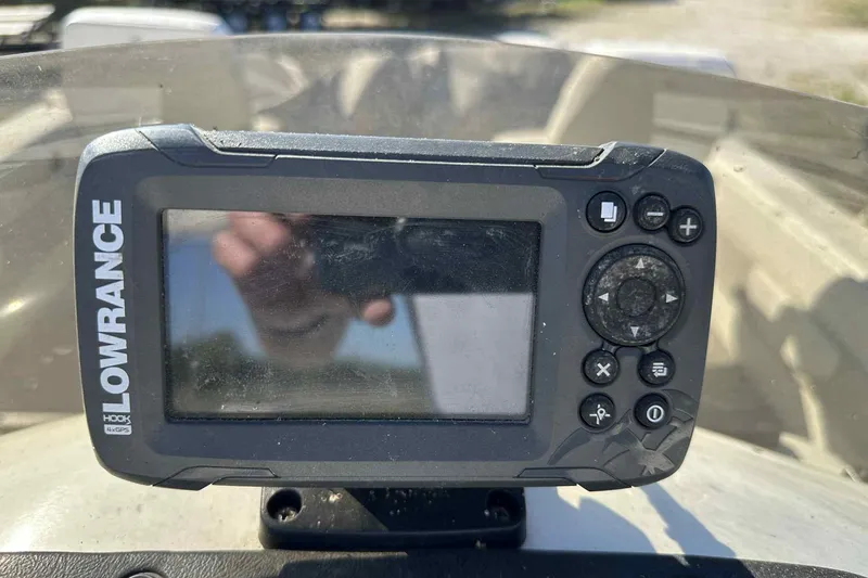 Slide: The Image of Lowrance fish finder on 2003 Beachcomber 24 Fish & Play boat dashboard. - 6