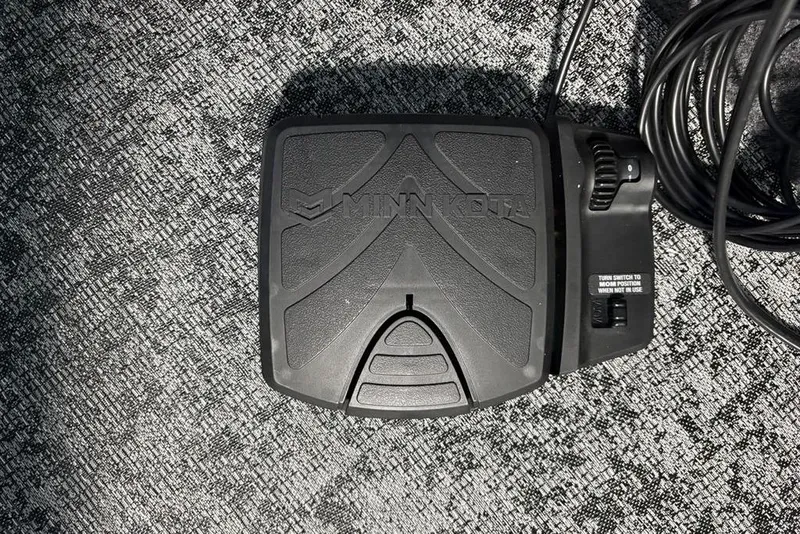 Slide: The Image of Minn Kota foot pedal on carpet, compatible with 2026 Tracker Pro Guide V-175 Combo. - 10