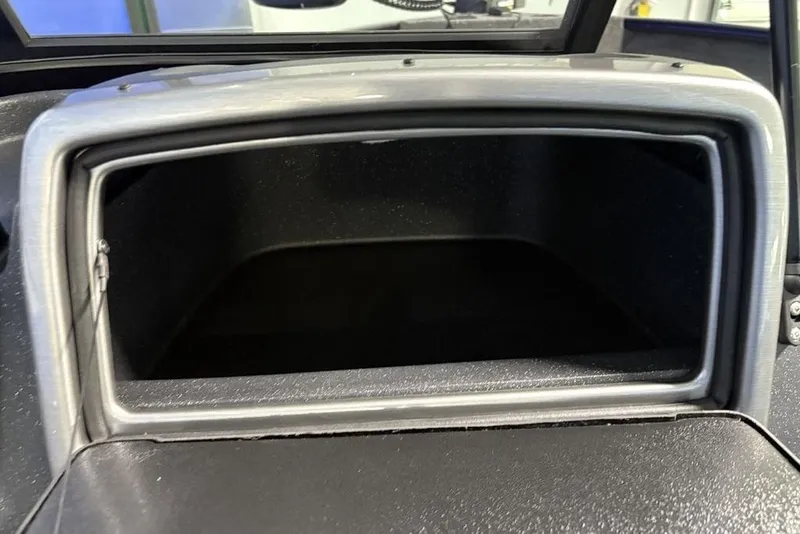 Slide: The Image of Open storage compartment in 2026 Tracker Pro Guide V-175 Combo boat. - 14