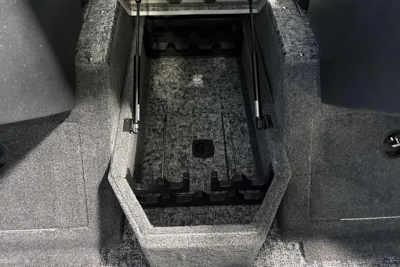 Slide: The Image of 2026 Tracker Pro Guide V-175 Combo interior storage compartment with carpeted finish. - 15
