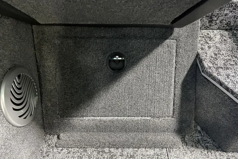 Slide: The Image of 2026 Tracker Pro Guide V-175 Combo interior with speaker and carpeted flooring. - 16