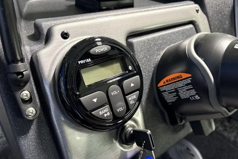 Slide: The Image of Control panel of 2026 Tracker Pro Guide V-175 Combo boat with warning label. - 17