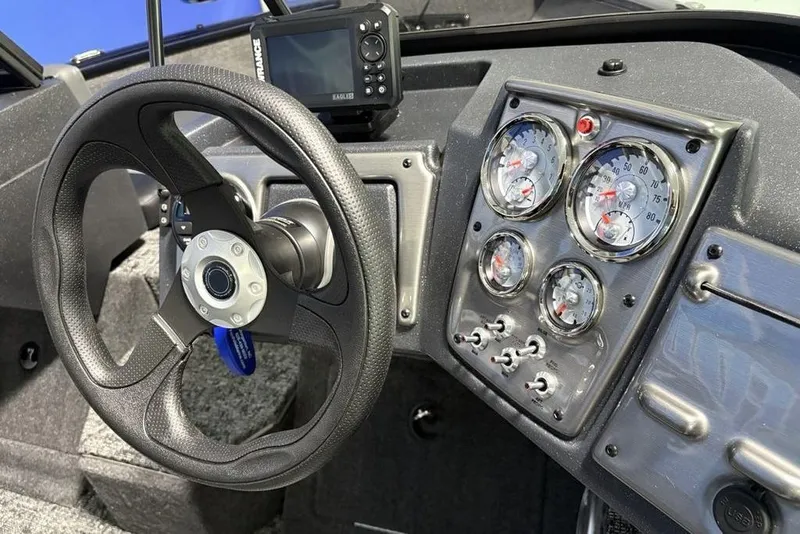 Slide: The Image of 2026 Tracker Pro Guide V-175 Combo dashboard with steering wheel and gauges. - 21