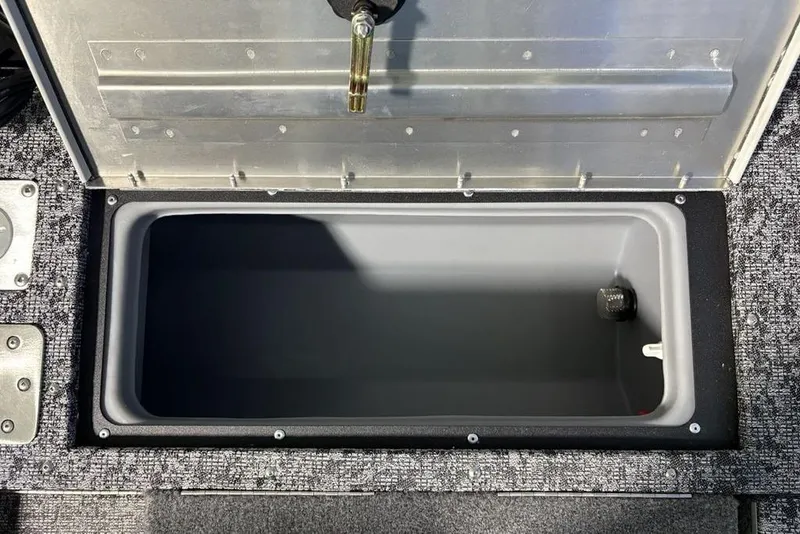 Slide: The Image of Open storage compartment in 2026 Tracker Pro Guide V-175 Combo boat. - 29