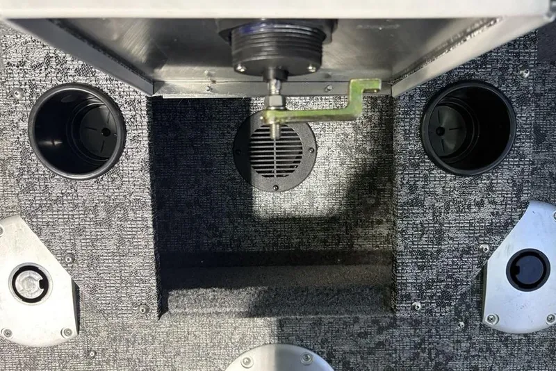 Slide: The Image of Interior view of 2026 Tracker Pro Guide V-175 Combo boat, featuring cup holders and speaker. - 31