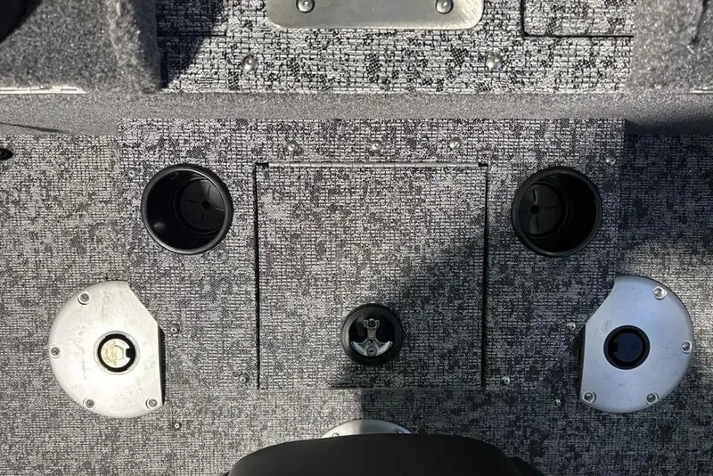 Slide: The Image of 2026 Tracker Pro Guide V-175 Combo boat interior with cup holders and storage compartments. - 34