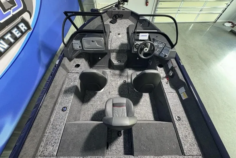 Slide: The Image of 2026 Tracker Pro Guide V-175 Combo boat interior with seating and steering console. - 36
