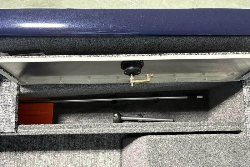 Slide: The Image of Storage compartment of 2026 Tracker Pro Guide V-175 Combo boat, featuring organized interior space. - 39