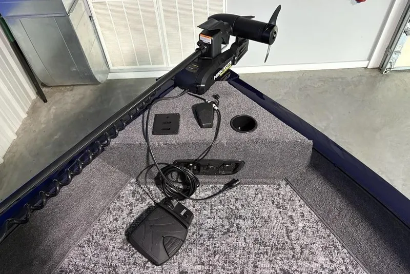 Slide: The Image of 2026 Tracker Pro Guide V-175 Combo boat interior with trolling motor and foot pedal. - 8