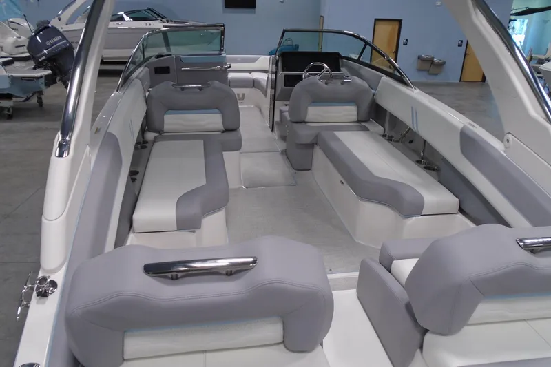 Slide: The Image of 2026 Regal LX6 boat interior with gray seating and modern design. - 11