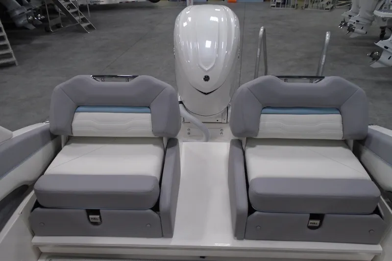 Slide: The Image of 2026 Regal LX6 boat interior with dual gray and white cushioned seats. - 22
