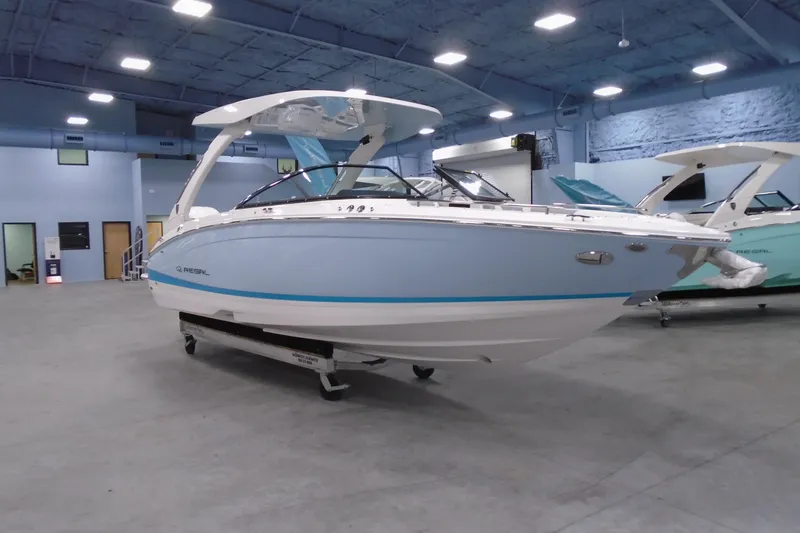 Slide: The Image of 2026 Regal LX6 boat displayed indoors, showcasing sleek design and modern features. - 5