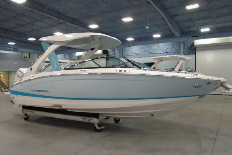 Slide: The Image of 2026 Regal LX6 boat in showroom, featuring sleek design and modern amenities. - 6