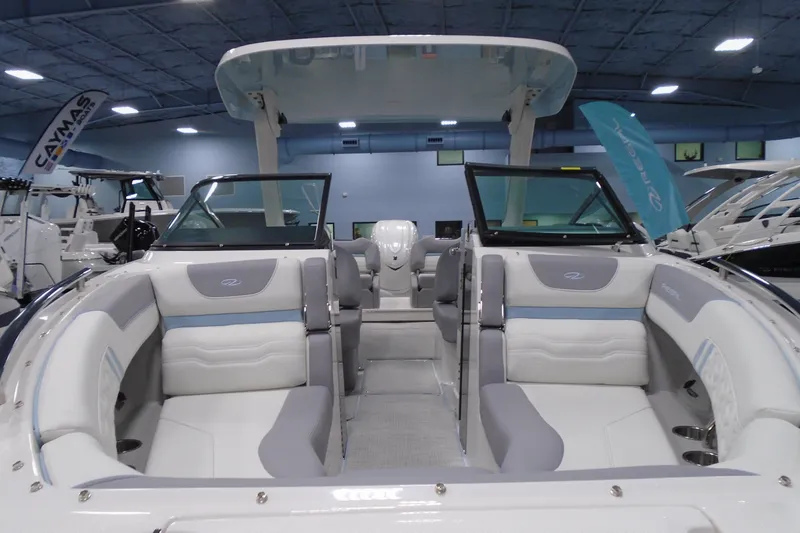 Slide: The Image of 2026 Regal LX6 boat interior with luxurious seating and modern design in a showroom. - 7