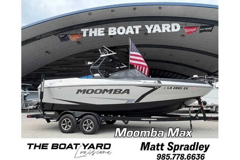 Slide: The Image of 2019 Moomba Max boat at The Boat Yard, Louisiana, with American flag. - 0