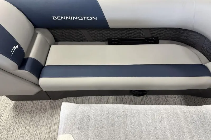 Slide: The Image of 2026 Bennington 23 SSBSF boat interior with blue and gray seating. - 16