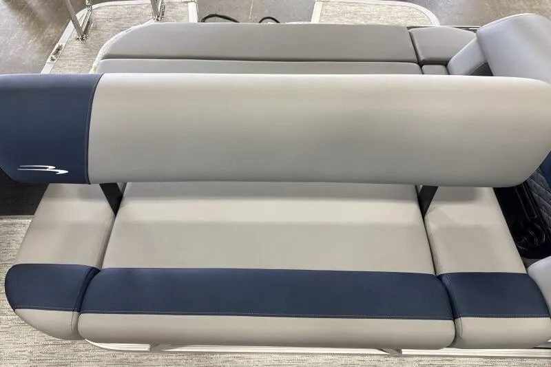 Slide: The Image of 2026 Bennington 23 SSBSF boat seating, featuring sleek gray and blue upholstery. - 18